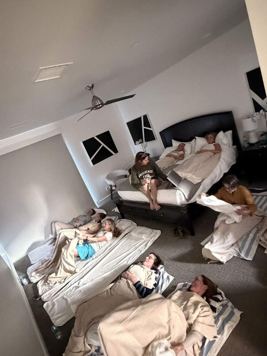 Mothers resting together during a guided relaxation on the retreat weekend