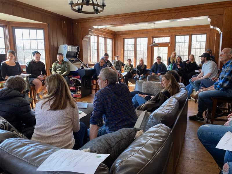 Providence Farm families gathered together in the house for family programming