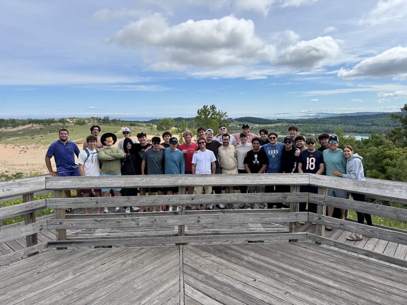 Providence Farm residents and staff on an overlook deck above the dunes